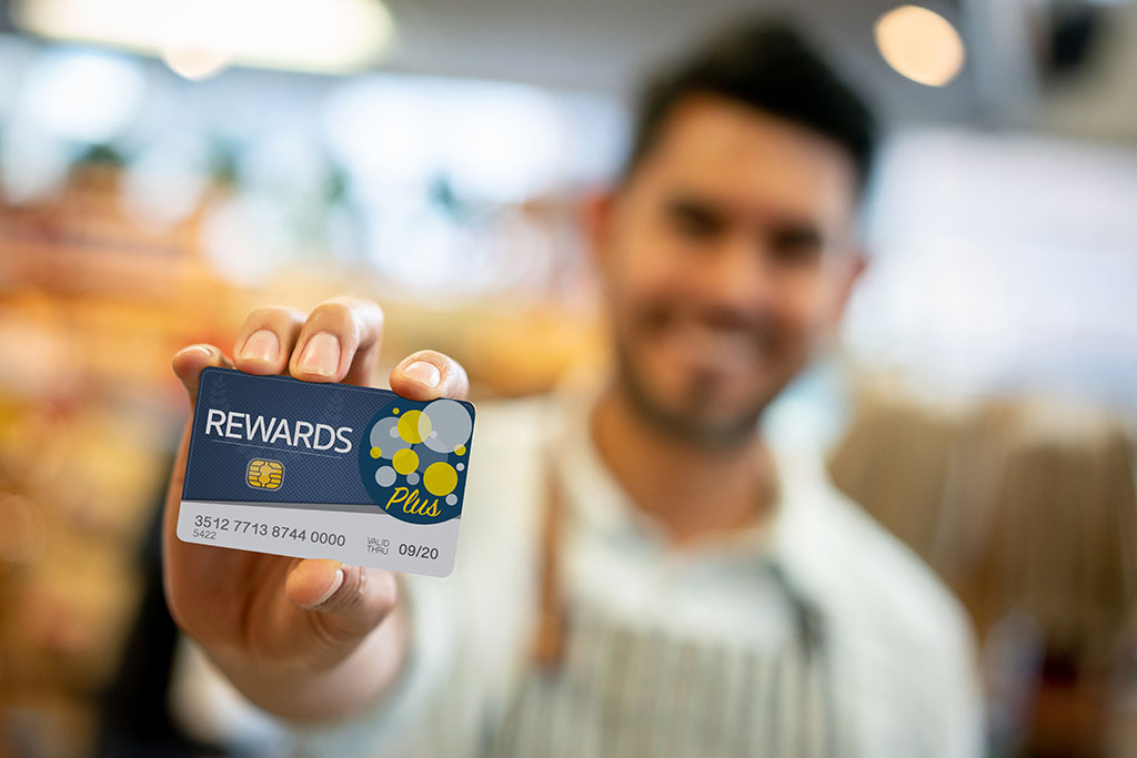 Person holding rewards card