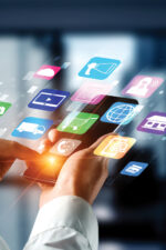 Person holing phone, app icons showing