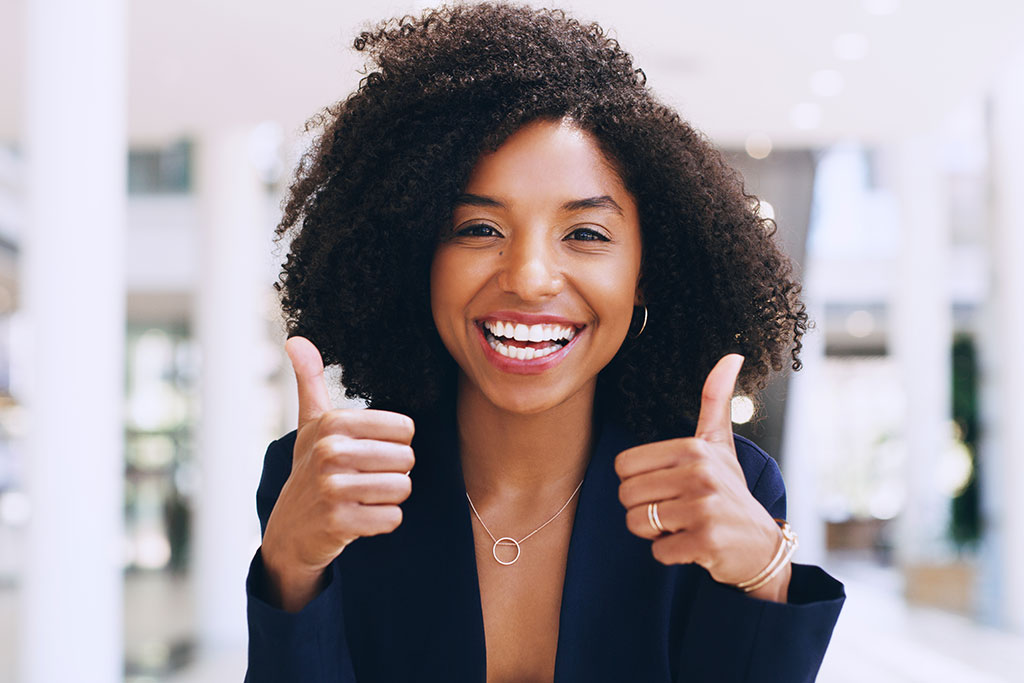 Young woman with her thumbs up