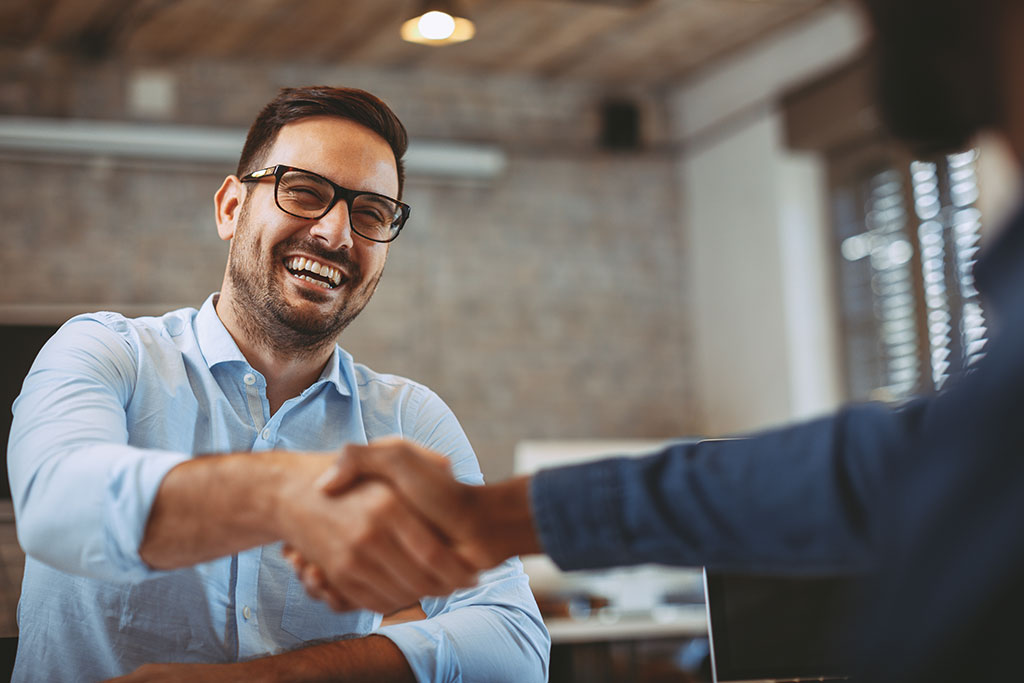Young man shaking hands