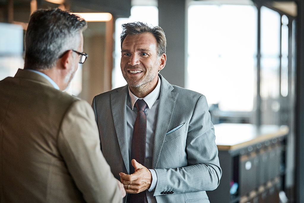 Business men talking at work