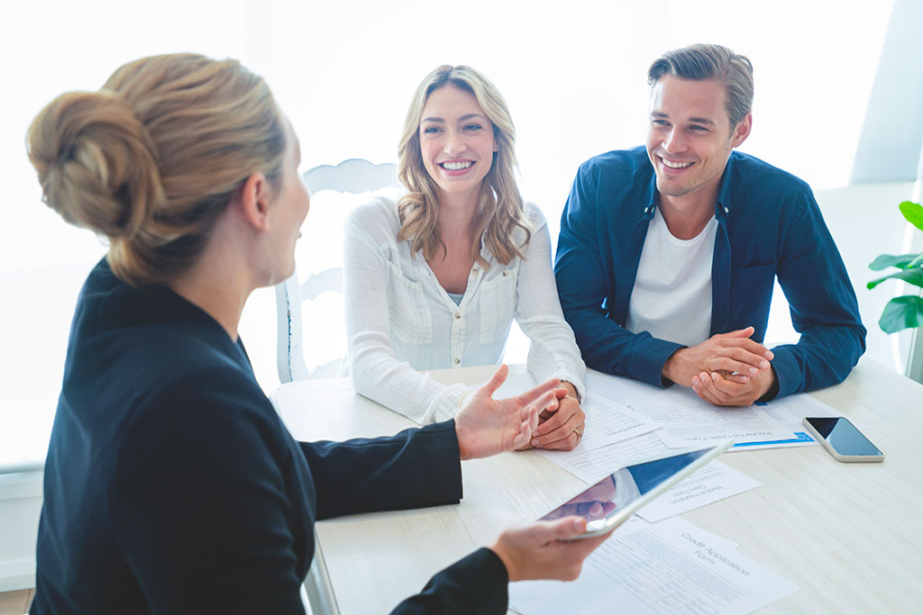 Couple talking with advisor