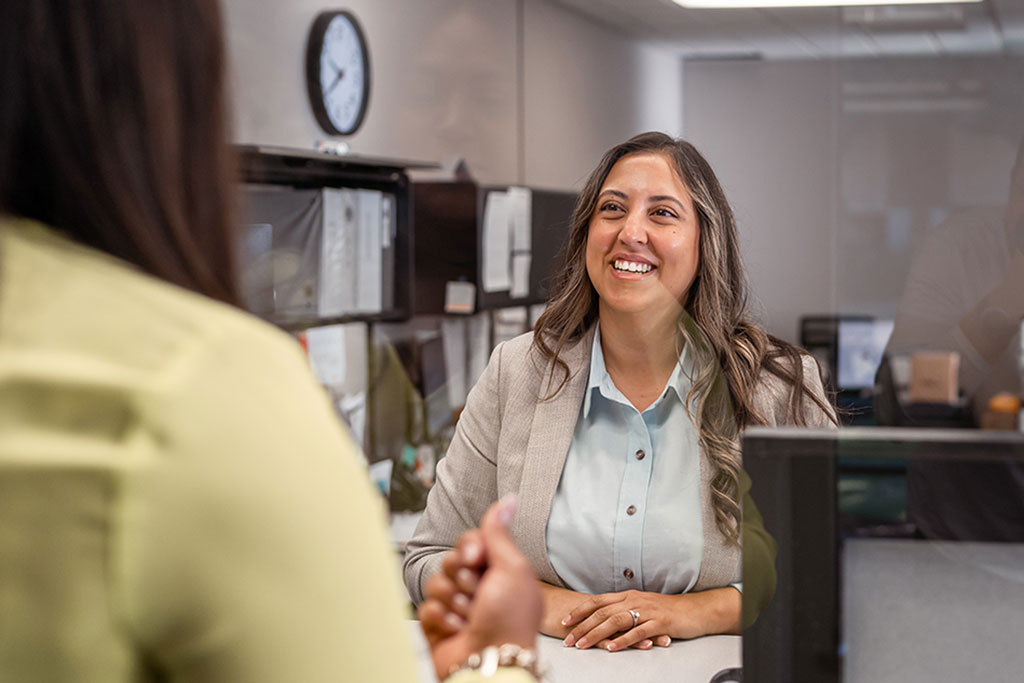 Business owner talking with customer