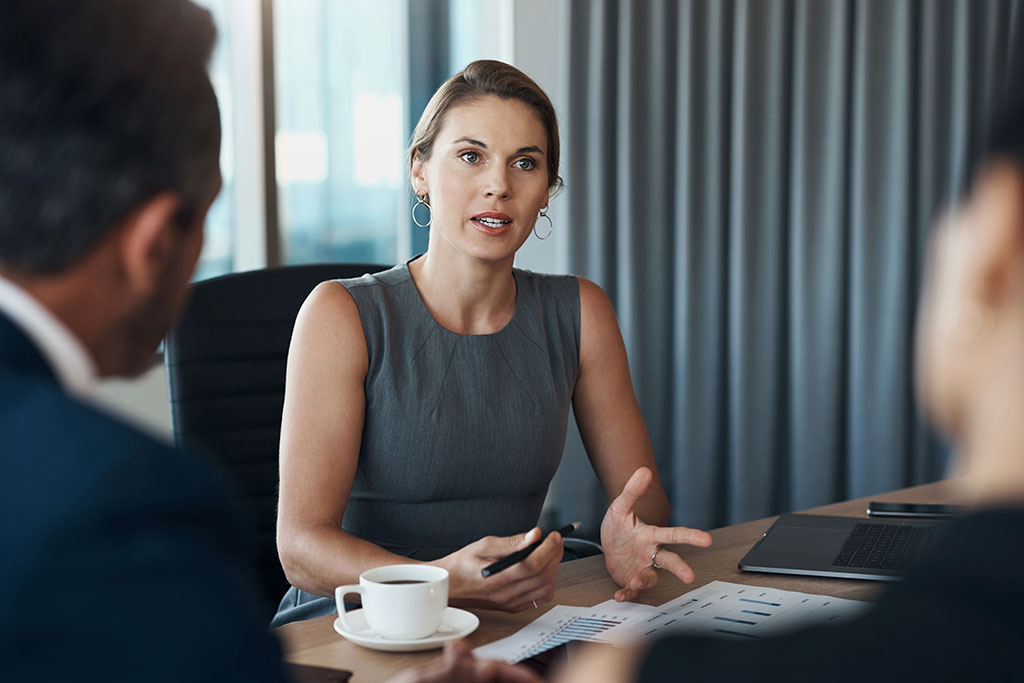 Woman in meeting talking