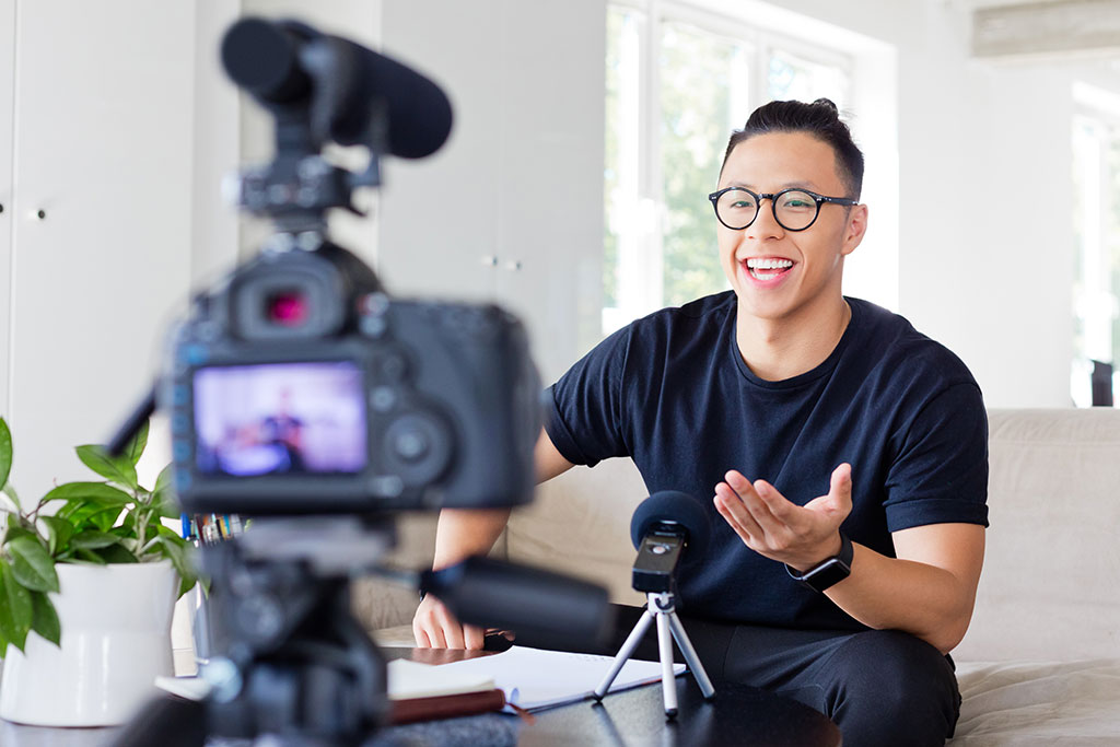 Business man recording himself giving presentation