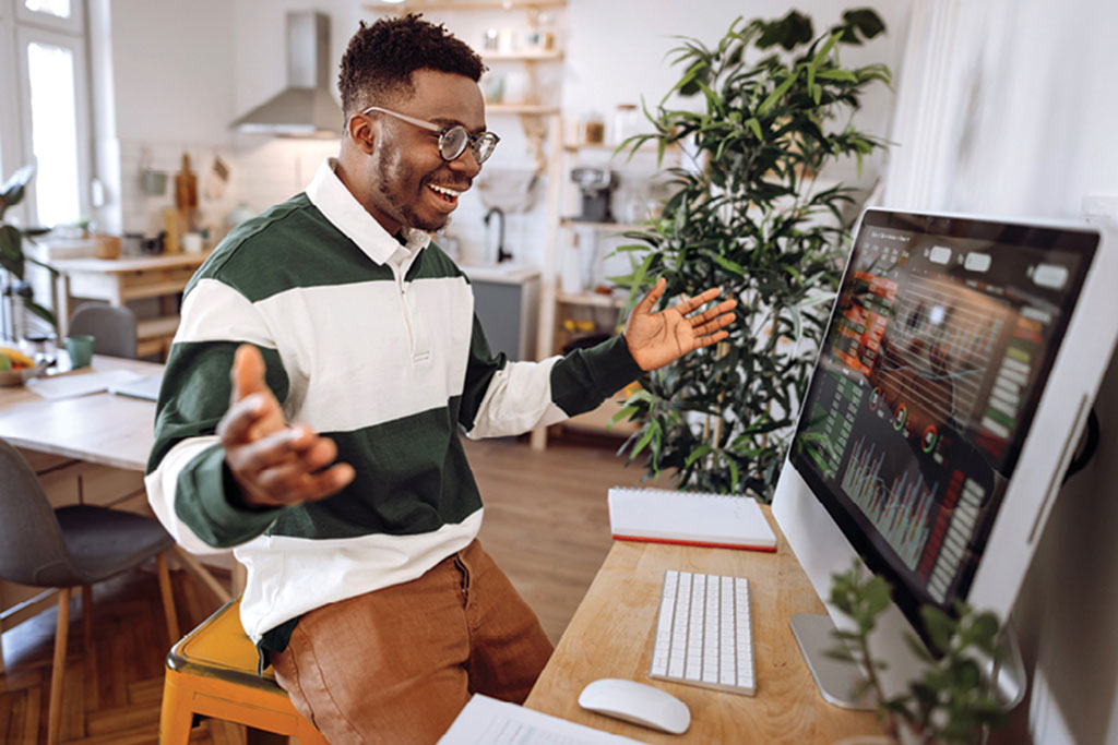 Man looking at desktop computer