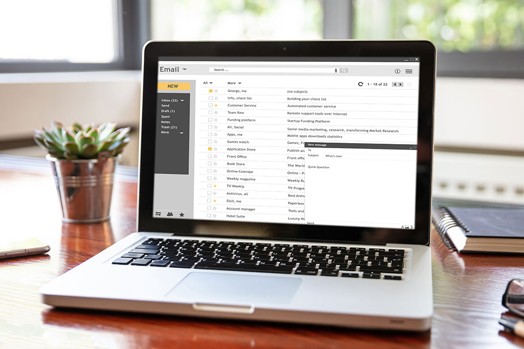 Laptop open to emails