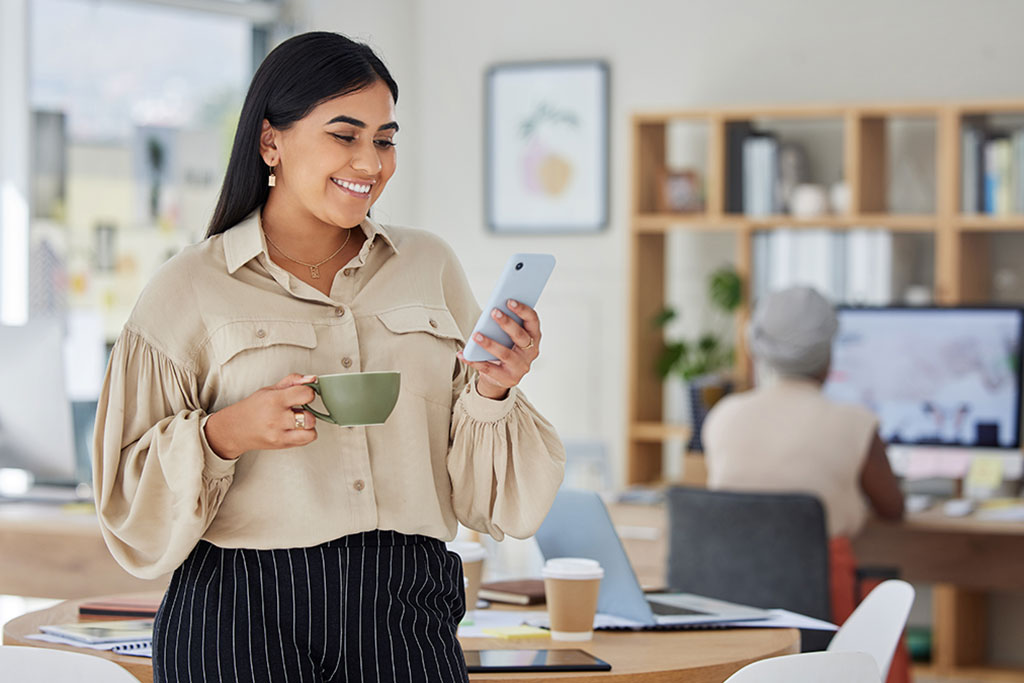 Business woman posting on phone