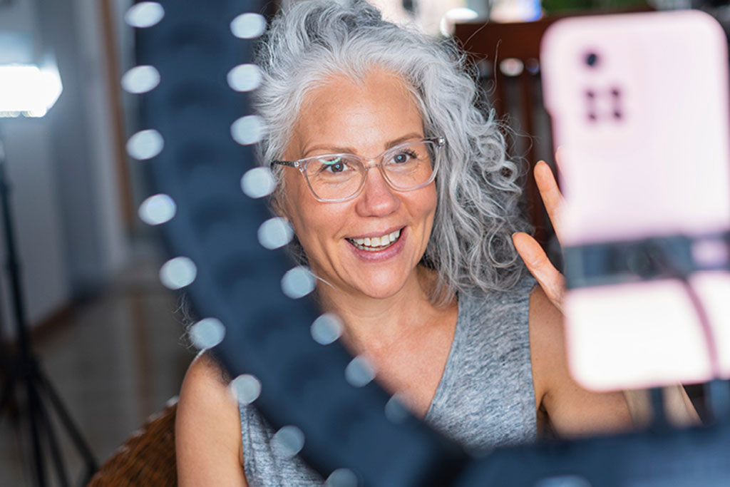 Woman using phone to record for social media