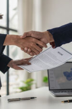 Business people shaking hands during interview