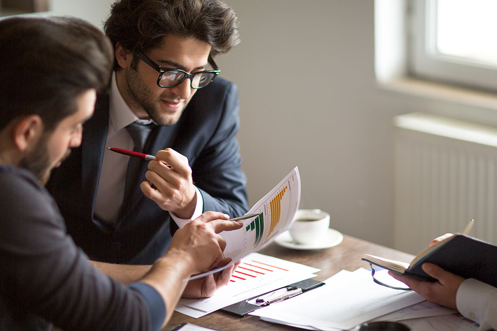 Co-workers looking over paperwork
