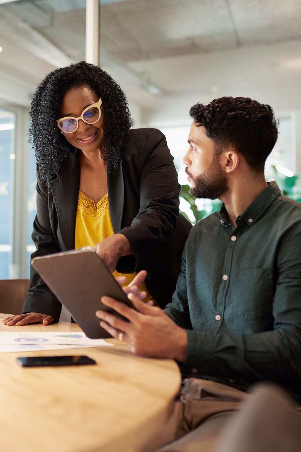 Boss talking to employee in office