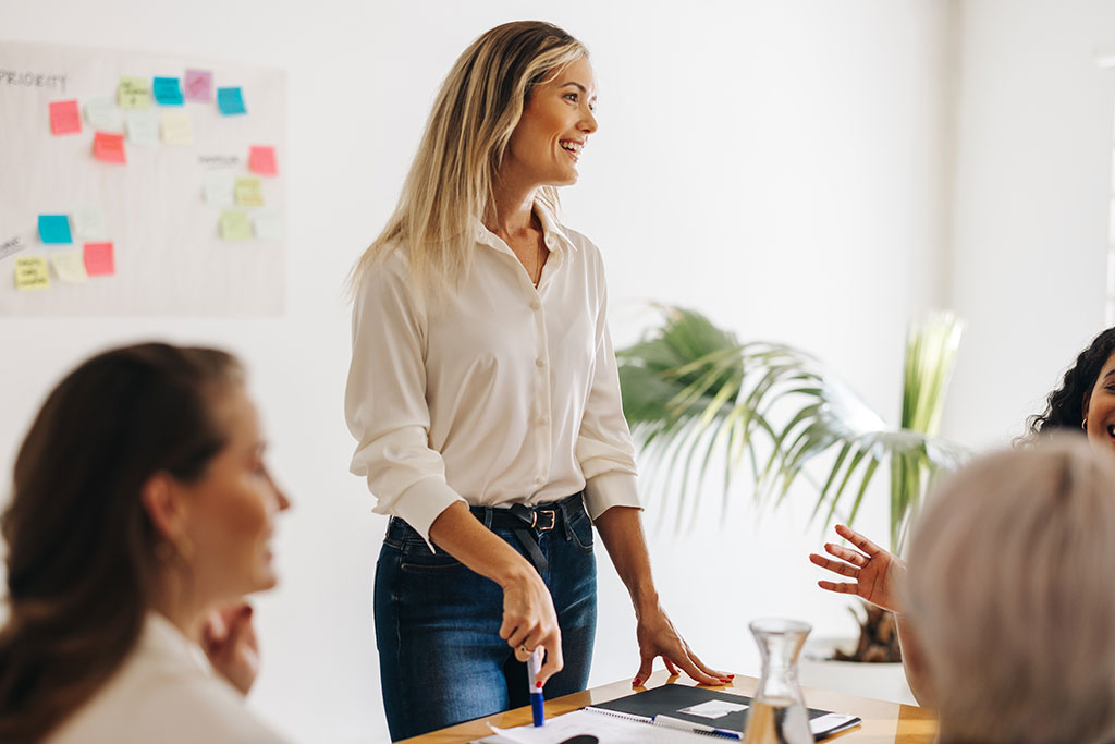 Woman leading business meeting