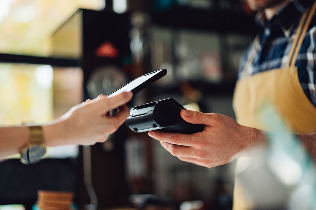 Person paying at register