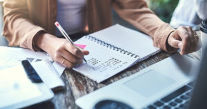 Writing goals down in planner