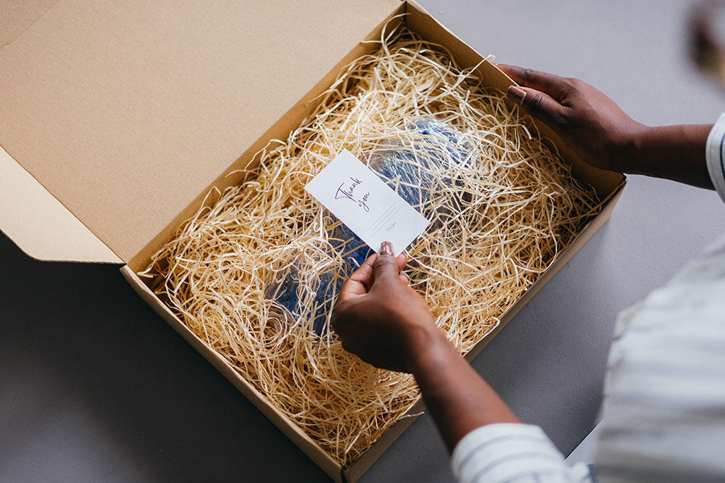 Woman opening thank you package