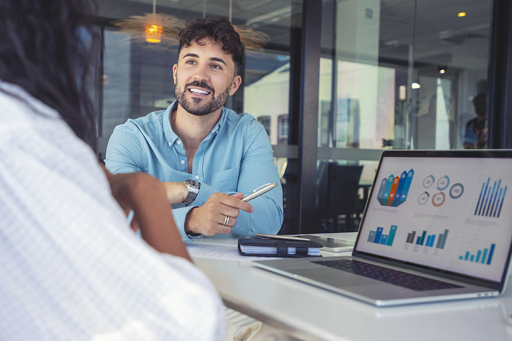 Business people looking over analytics