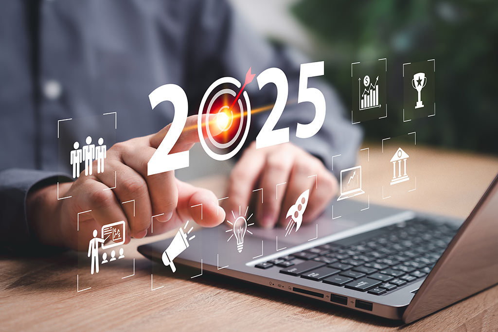 2025 graphics above business laptop