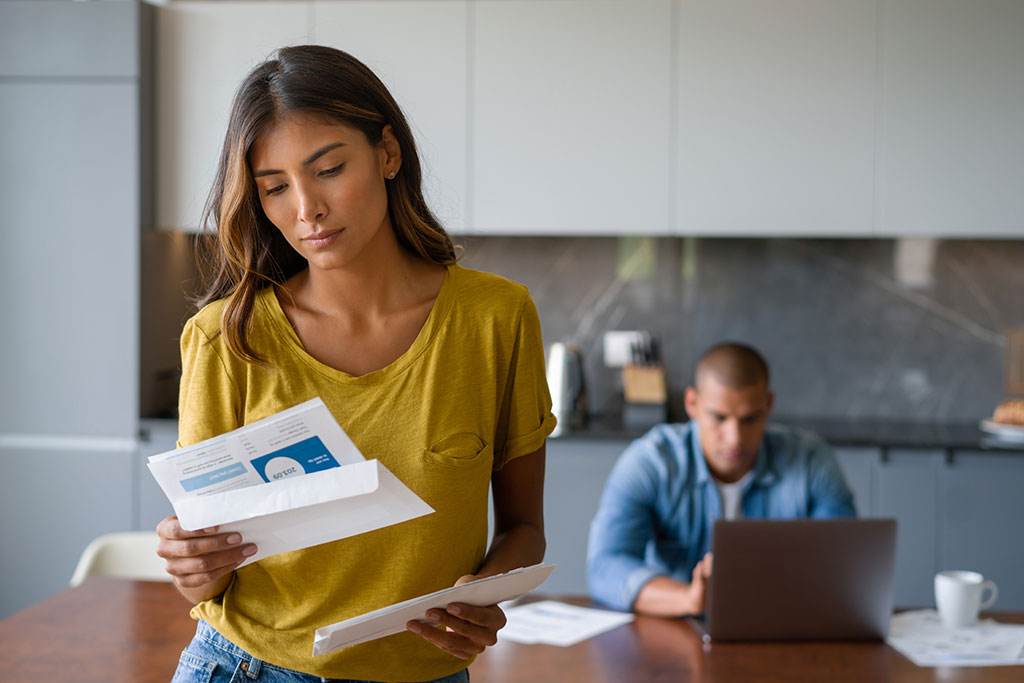 Woman looking at print marketing mailing