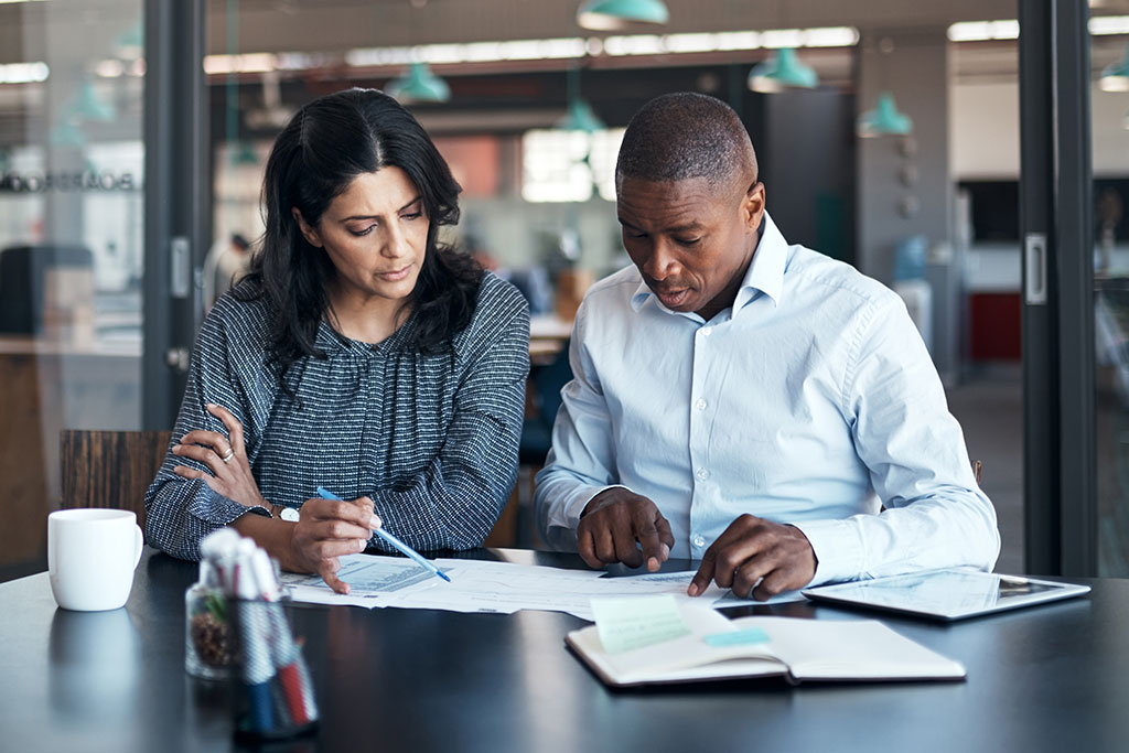 Business people looking over paper work