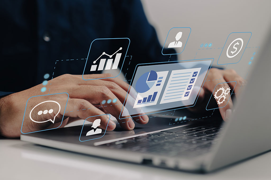 Business graphics above laptop