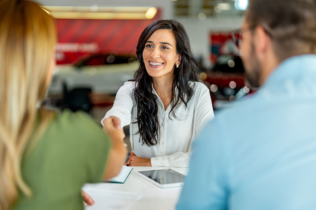 Couple talking with sales person