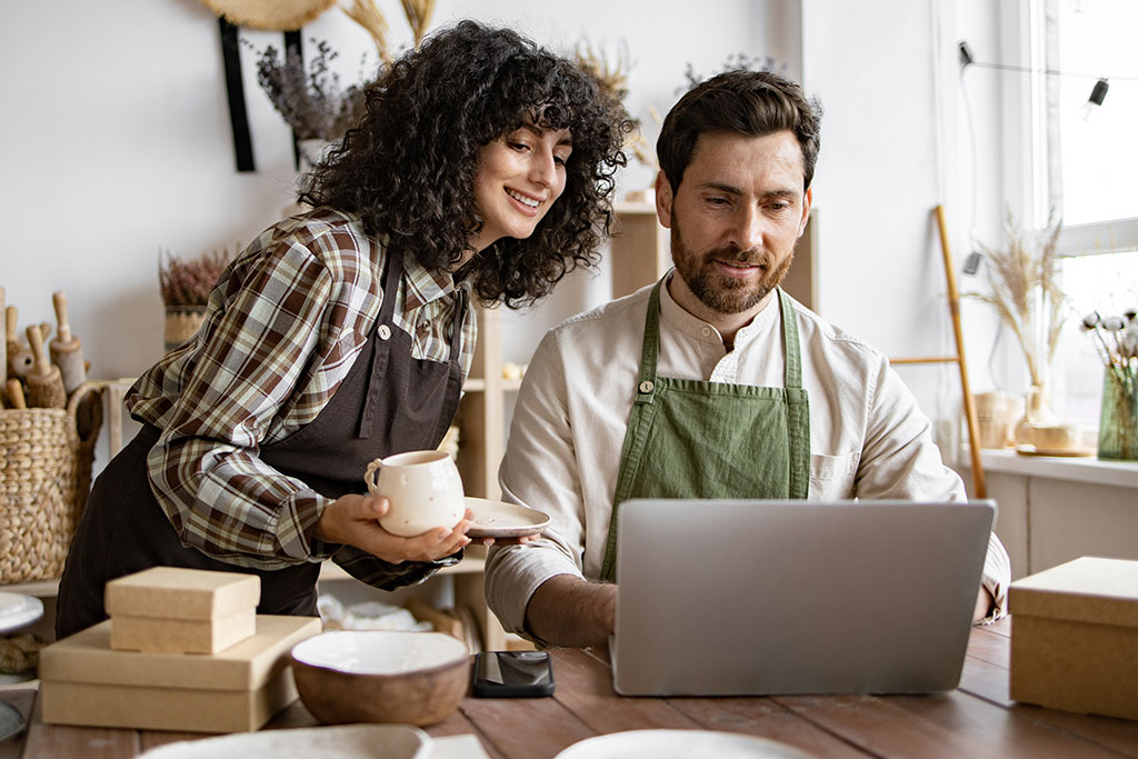 Business owners looking at laptop